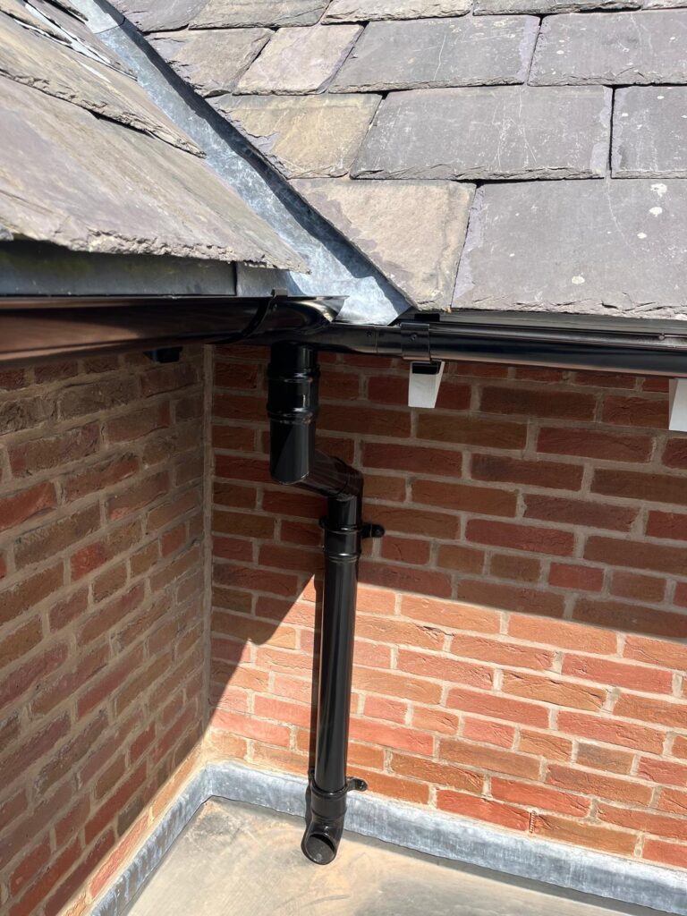 close up of aluminium gutters and downpipes