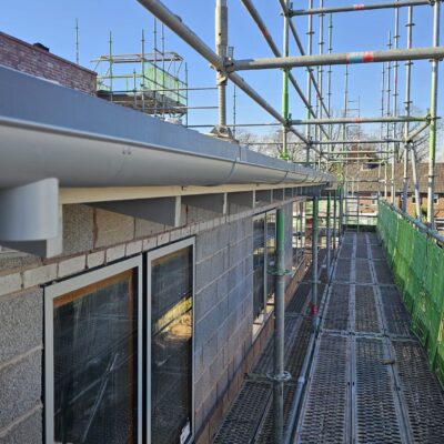 half round aluminium gutters and downpipes at a commercial property in Liverpool