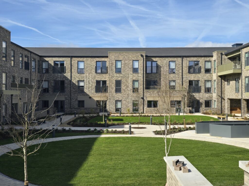 A care home building with new aluminium guttering, pipes and architectural details