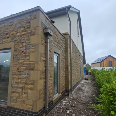 aluminium box guttering on the side of a house