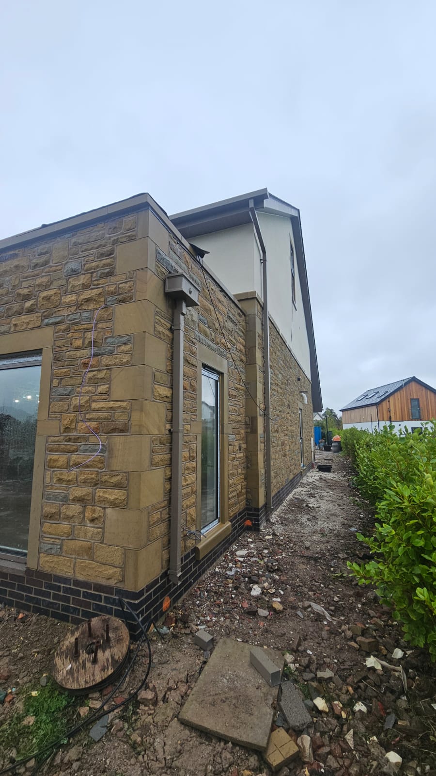 aluminium box guttering on the side of a house