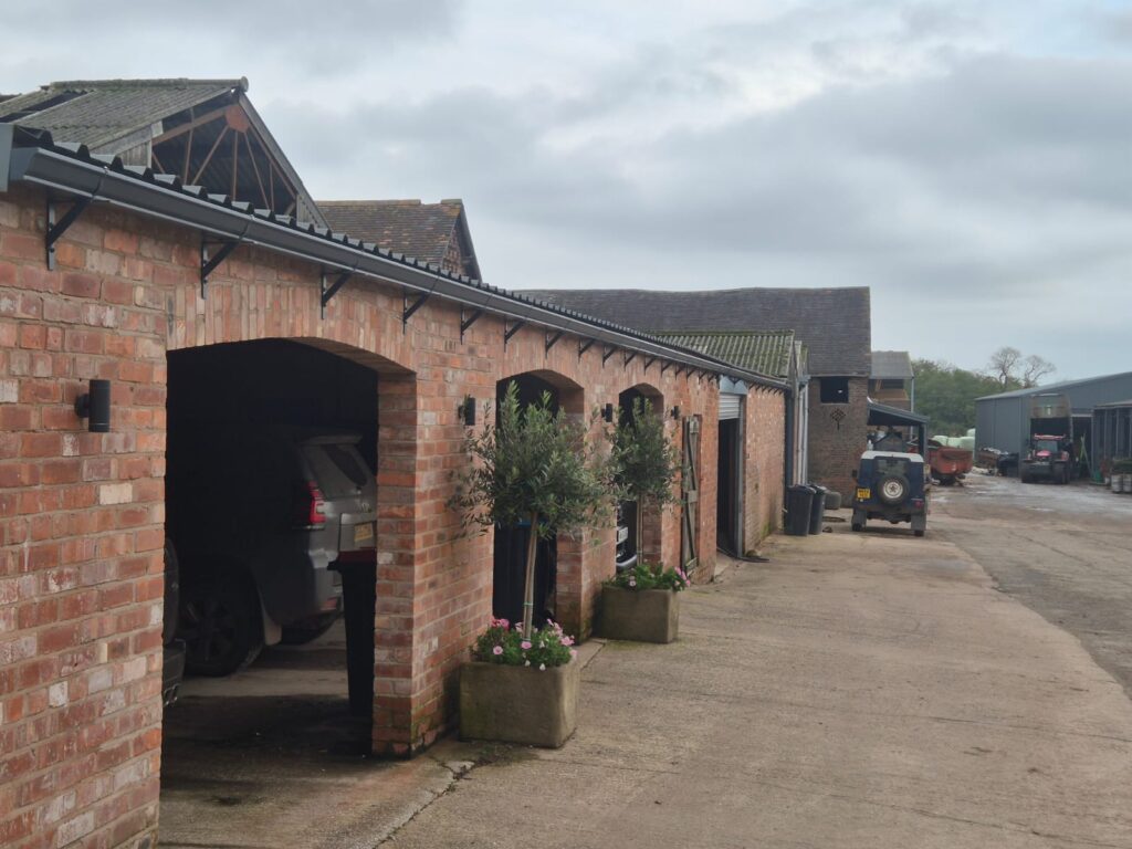 seamless guttering on L-shaped brackets at a farm building